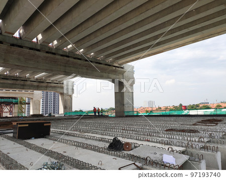 SELANGOR, MALAYSIA -JULY 6, 2022: An elevated road is under construction. Reinforced concrete is used for the structure. Construction is done in stages according to the sequence of works. SELANGOR, MALAYSIA -JULY 6, 2022: An elevated road is under construction. Reinforced concrete is used for the structure. Construction is done in stages according to the sequence of works. 97193740
