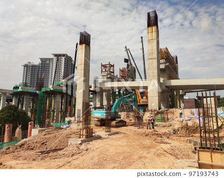 SELANGOR, MALAYSIA -JULY 6, 2022: An elevated road is under construction. Reinforced concrete is used for the structure. Construction is done in stages according to the sequence of works. SELANGOR, MALAYSIA -JULY 6, 2022: An elevated road is under construction. Reinforced concrete is used for the structure. Construction is done in stages according to the sequence of works. 97193743
