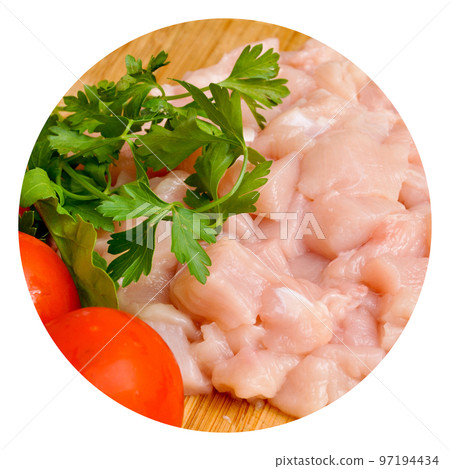 Fresh uncooked chicken meat breast pieces, ready to cook, with tomato and parsley Fresh uncooked chicken meat breast pieces, ready to cook, with tomato and parsley 97194434