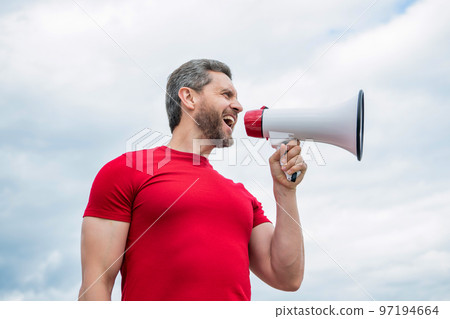 man salesman in red shirt shout in loudspeaker on sky background man salesman in red shirt shout in loudspeaker on sky background 97194664