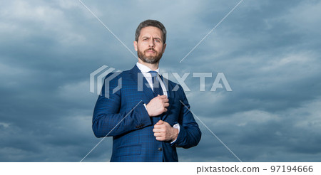 Portrait of businessman sky background. Businessman in suit. Serious grizzled businessman outdoors Portrait of businessman sky background. Businessman in suit. Serious grizzled businessman outdoors 97194666