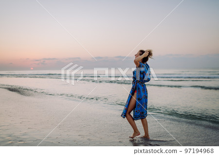 Young woman enjoying time at sea during hot summer. 97194968