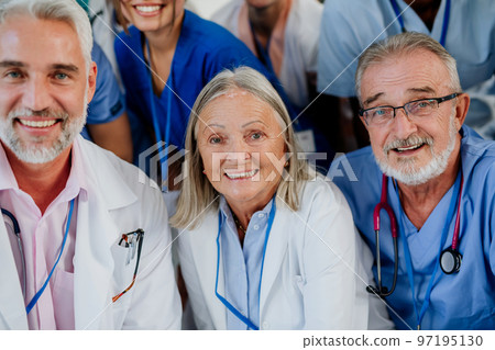 Portrait of happy doctors, nurses and other medical staff in hospital. 97195130