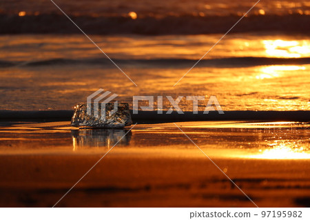 Ice blocks on the beach at sunrise Ice blocks on the beach at sunrise 97195982