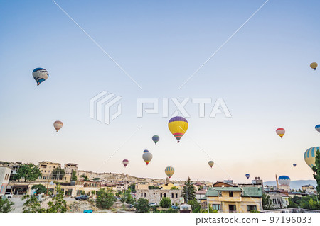 Colorful hot air balloon flying over Cappadocia, Turkey 97196033
