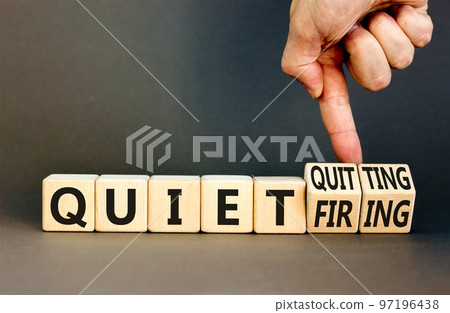 Quiet quitting or firing symbol. Concept words Quiet quitting Quiet firing on cubes. Businessman hand. Beautiful grey table grey background. Business quiet quitting or firing concept. Copy space. Quiet quitting or firing symbol. Concept words Quiet quitting Quiet firing on cubes. Businessman hand. Beautiful grey table grey background. Business quiet quitting or firing concept. Copy space. 97196438