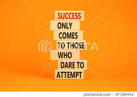 Success symbol. Concept words Success only comes to those who dare to attempt on wooden blocks. Beautiful orange background copy space. Business success and attempt concept. 97196442
