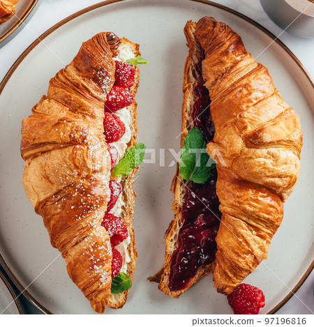 Croissant with fresh raspberries 97196816