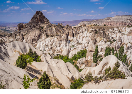 Beautiful stunning view of the mountains of Cappadocia and cave houses. Turkey Beautiful stunning view of the mountains of Cappadocia and cave houses. Turkey 97196873
