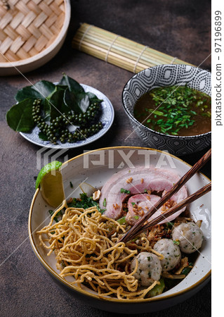 Miso Ramen Asian noodles with pork and meatballs in bowl on dark background 97196899