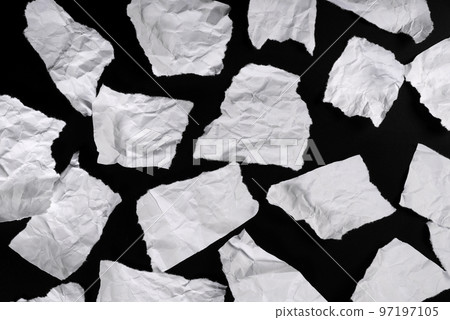 Pieces of torn paper, for message on black background Pieces of torn paper, for message on black background 97197105