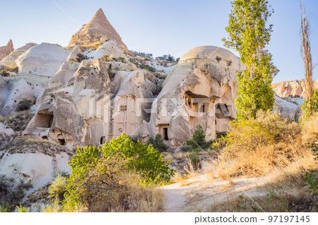 Beautiful stunning view of the mountains of Cappadocia and cave houses. Turkey Beautiful stunning view of the mountains of Cappadocia and cave houses. Turkey 97197145