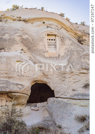 Beautiful stunning view of the mountains of Cappadocia and cave houses. Turkey Beautiful stunning view of the mountains of Cappadocia and cave houses. Turkey 97197147