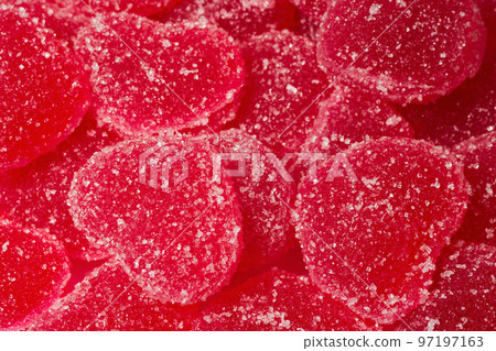 A close-up of marmalade in the form of a heart. A close-up of marmalade lollipops 97197163