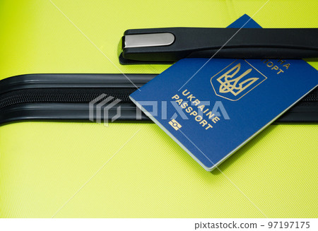 Passport of Ukraine and luggage at the airport. Suitcase close-up Passport of Ukraine and luggage at the airport. Suitcase close-up 97197175
