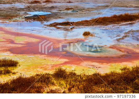 Yellowstone alkaline waters of colorful pools in winter 97197336