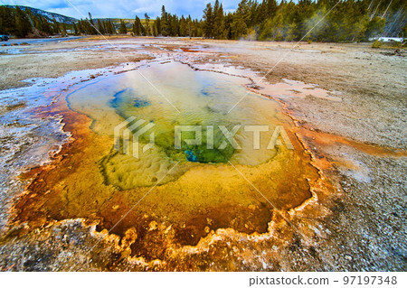 Yellowstone hot spring with warm and cool colors 97197348