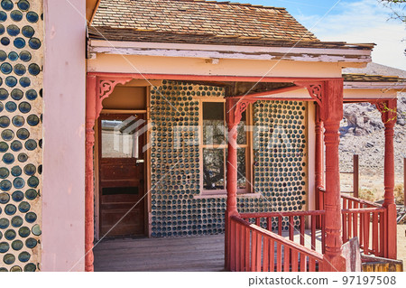 Unique house porch with walls of colorful glass bottles Unique house porch with walls of colorful glass bottles 97197508