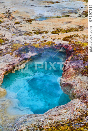 Vibrant blue alkaline thermal pool at Yellowstone in basin 97197515