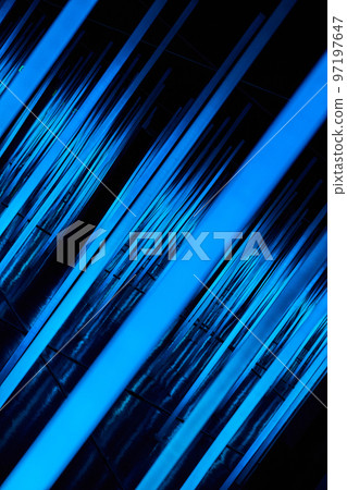 Abstract neon light poles angled in blue Abstract neon light poles angled in blue 97197647