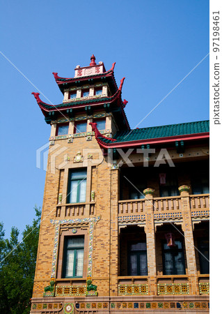 Chinatown in Chicago building with red brick and curved roof edge ornamentation Chinatown in Chicago building with red brick and curved roof edge ornamentation 97198461