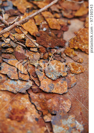 Fragments of rusted peeling metal textured background 97198543