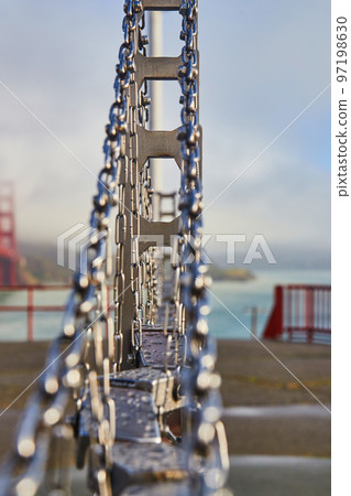 Miniature Golden Gate Bridge showing how it is built next to real thing 97198630
