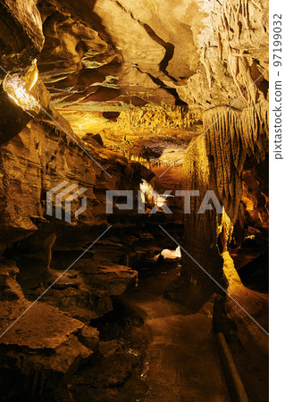 Large cave path with rock formations underground midwest america stalagmites and stalactites Large cave path with rock formations underground midwest america stalagmites and stalactites 97199032