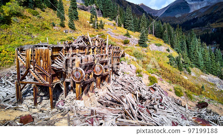 Detail of old beautiful mining mill equipment abandoned and falling apart in the mountains Detail of old beautiful mining mill equipment abandoned and falling apart in the mountains 97199188