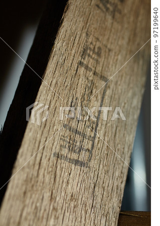 Dramatically lit wooden board with burning Dramatically lit wooden board with burning 97199640