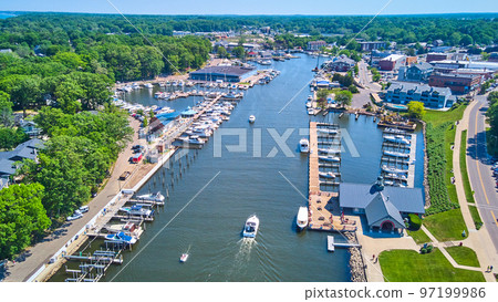 Aerial of river canal filled with boats in docks Aerial of river canal filled with boats in docks 97199986