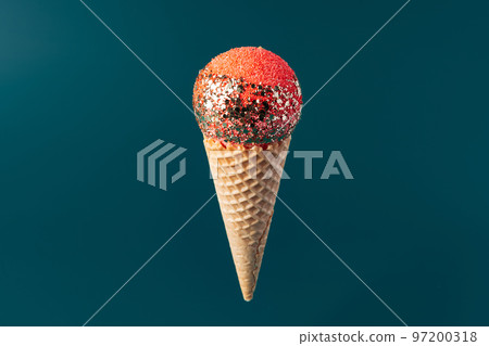 Christmas fun decorative fake ice cream cone on dark green background Christmas fun decorative fake ice cream cone on dark green background 97200318