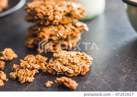 Sweet oatmeal cookies on kitchen table. Sweet oatmeal cookies on kitchen table. 97201027