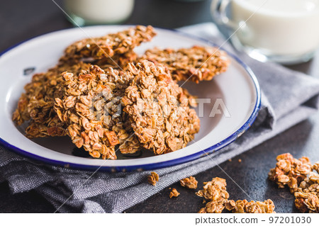 Sweet oatmeal cookies on plate on kitchen table. Sweet oatmeal cookies on plate on kitchen table. 97201030