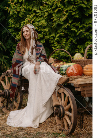 Beautiful young bride in a boho dress. Beautiful young bride in a boho dress. 97201083