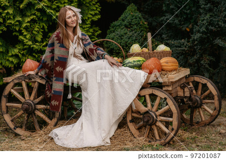 Beautiful young bride in a boho dress. 97201087