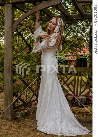 Beautiful young bride in a boho dress. Beautiful young bride in a boho dress. 97201098