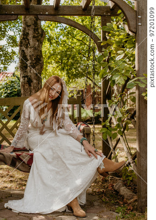 Beautiful young bride in a boho dress. Beautiful young bride in a boho dress. 97201099