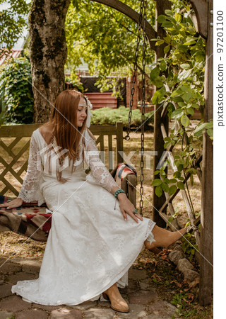 Beautiful young bride in a boho dress. Beautiful young bride in a boho dress. 97201100