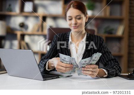 Woman counting money. Business investment. 97201331