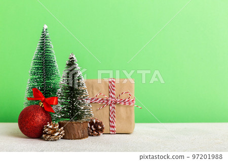 Christmas composition. Gifts, small tree, branches and craft DIY decorations on white background. New year concept. Christmas home decoration Flat lay, top view, copy space Christmas composition. Gifts, small tree, branches and craft DIY decorations on white background. New year concept. Christmas home decoration Flat lay, top view, copy space 97201988