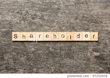 shareholder word written on wood block. shareholder text on table, concept shareholder word written on wood block. shareholder text on table, concept 97202058