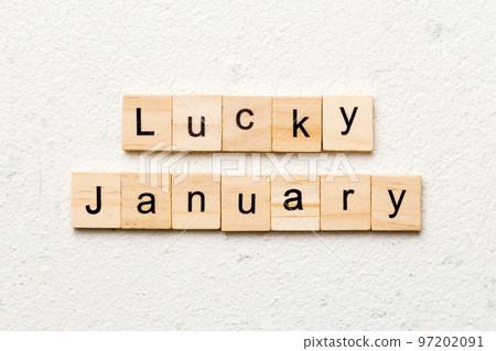 lucky january word written on wood block. lucky january text on table, concept 97202091
