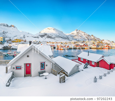 Marvelous snowy morning cityscape of Sorvagen town and port. Marvelous snowy morning cityscape of Sorvagen town and port. 97202243