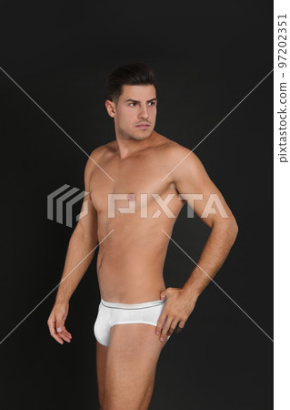 Handsome man in underwear on black background 97202351