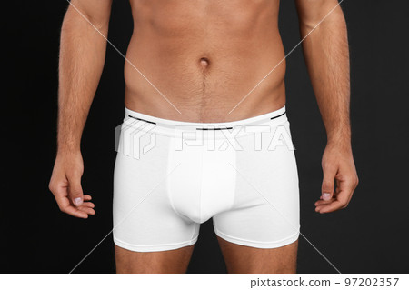 Man in underwear on black background, closeup 97202357