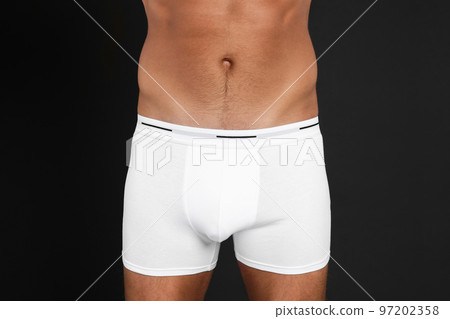Man in underwear on black background, closeup 97202358