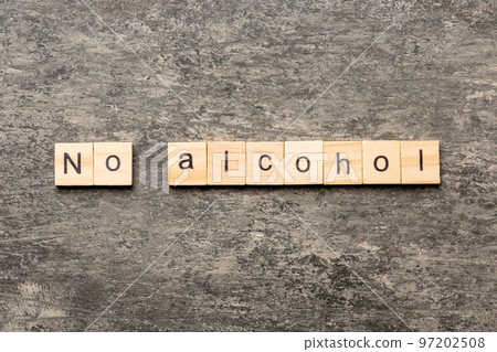 No alcohol word written on wood block. No alcohol text on cement table for your desing, Top view concept 97202508