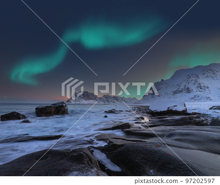Amazing winter scenery on Uttakleiv beachat night with Northern lights. 97202597