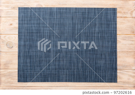Top view of grey tablecloth for food on wooden background. Empty space for your design 97202616